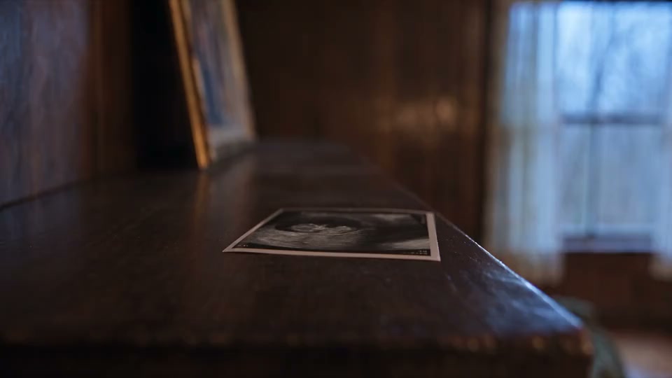 Generated footage of the textured mantel, photograph and window